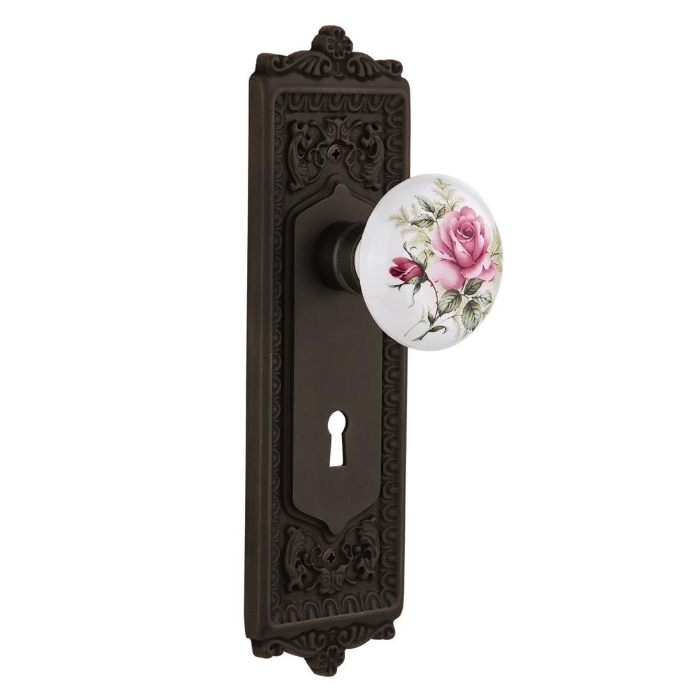 Nostalgic Warehouse EADROS Passage Knob Egg and Dart Plate with Rose Porcelain Knob with Keyhole in Oil Rubbed Bronze